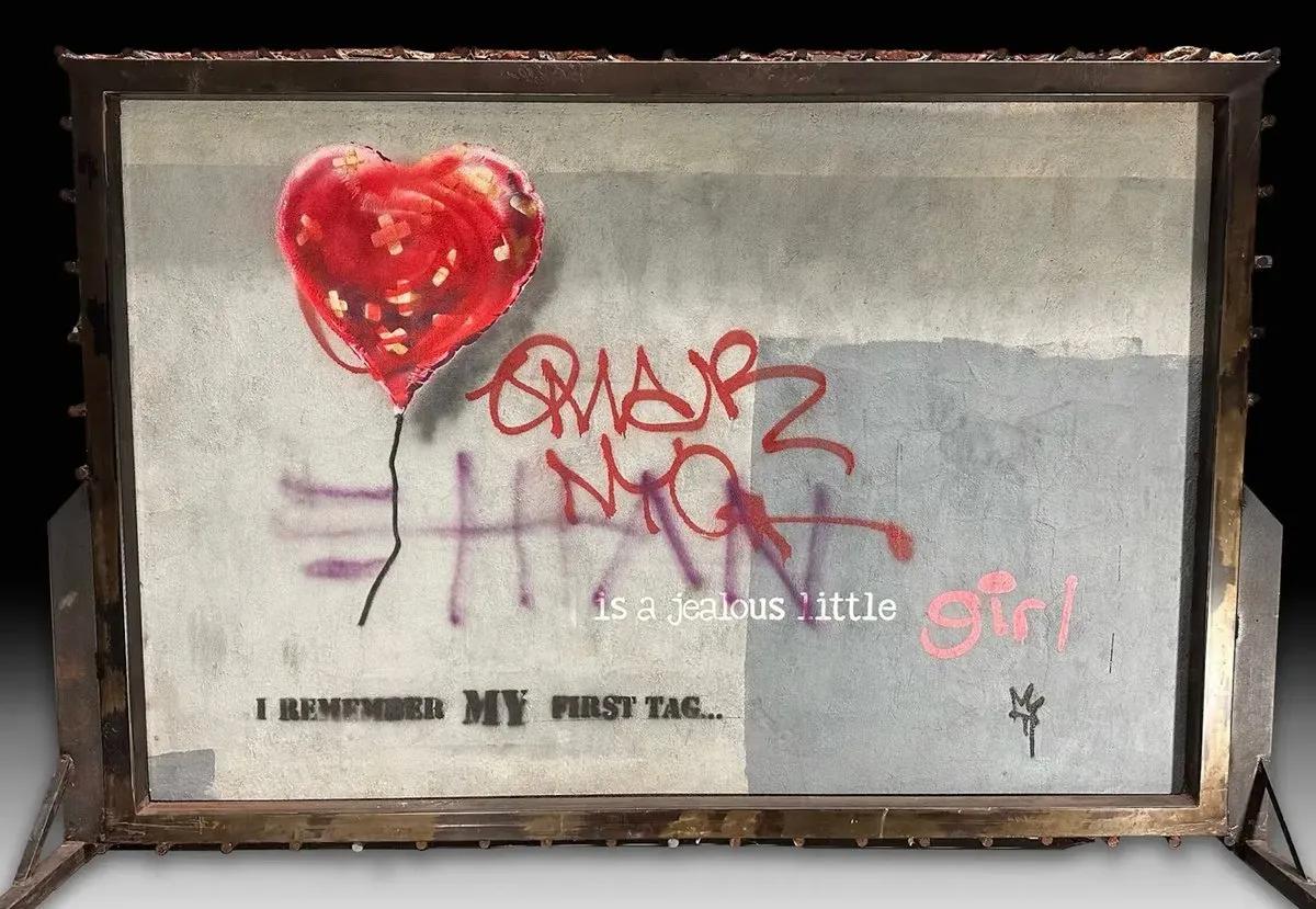 banksy's_balloon_heart_mural_returns_to_new_york_for_charity_auction_preview